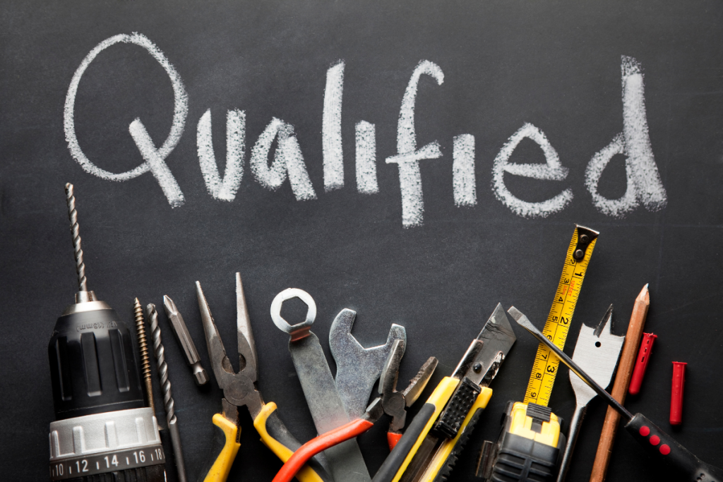 A Blackboard That Says Qualified With Tools Underneath - Commercial HVAC Services Toronto