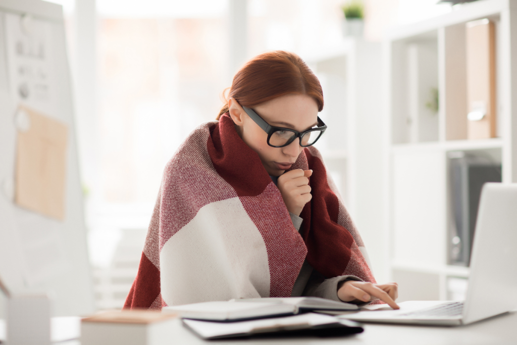 A Person In A Cold Office - Springbank Mechanical Toronto HVAC Company