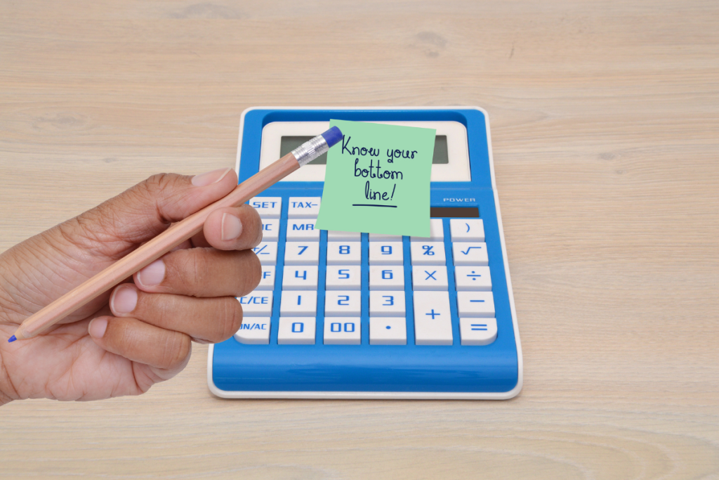 A Calculator With A Sticky Note Saying Your Bottom Line - Springbank Mechanical Toronto HVAC Company