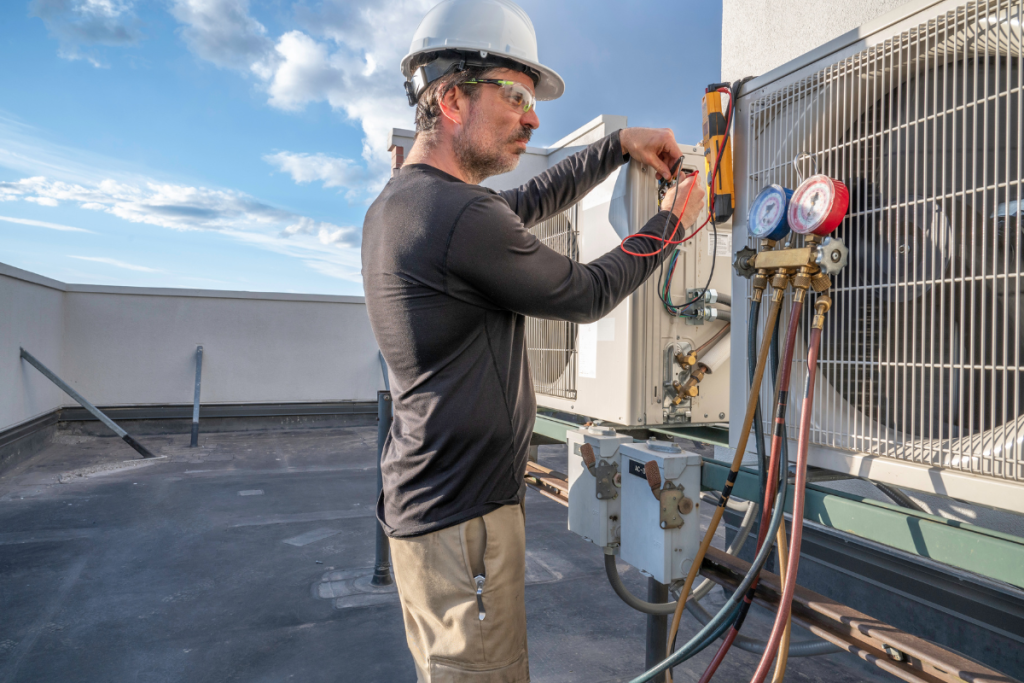 A Person Working On An HVAC Economizer - Springbank Mechanical Toronto HVAC Company