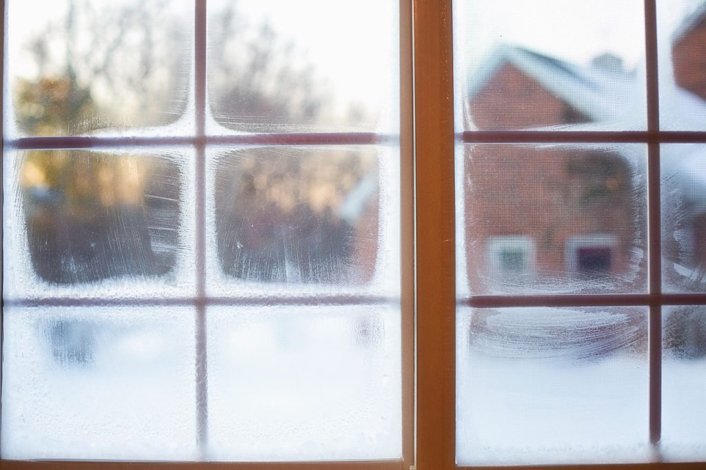 A Window With Frost On It Showing The Need For HVAC Winter Preparation - Springbank Mechanical Toronto HVAC Company