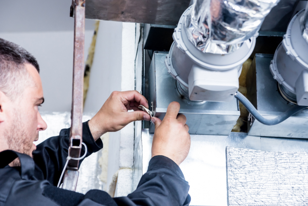 A Person Working On An HVAC Zoning System - Springbank Mechanical Toronto HVAC Company